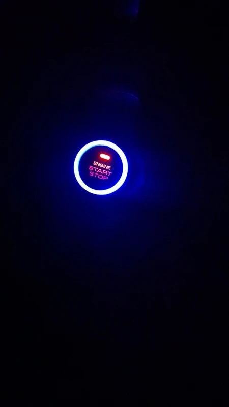 Illuminated engine start stop button at night